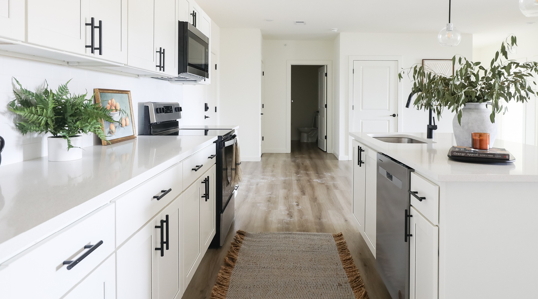 Well-lit kitchen with ample counter space at The Flats at Hampden in Camp Hill, PA